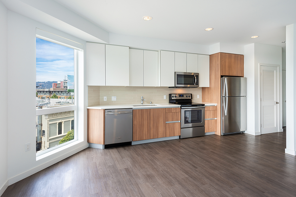 Kitchen with stainless appliances and tile backsplash