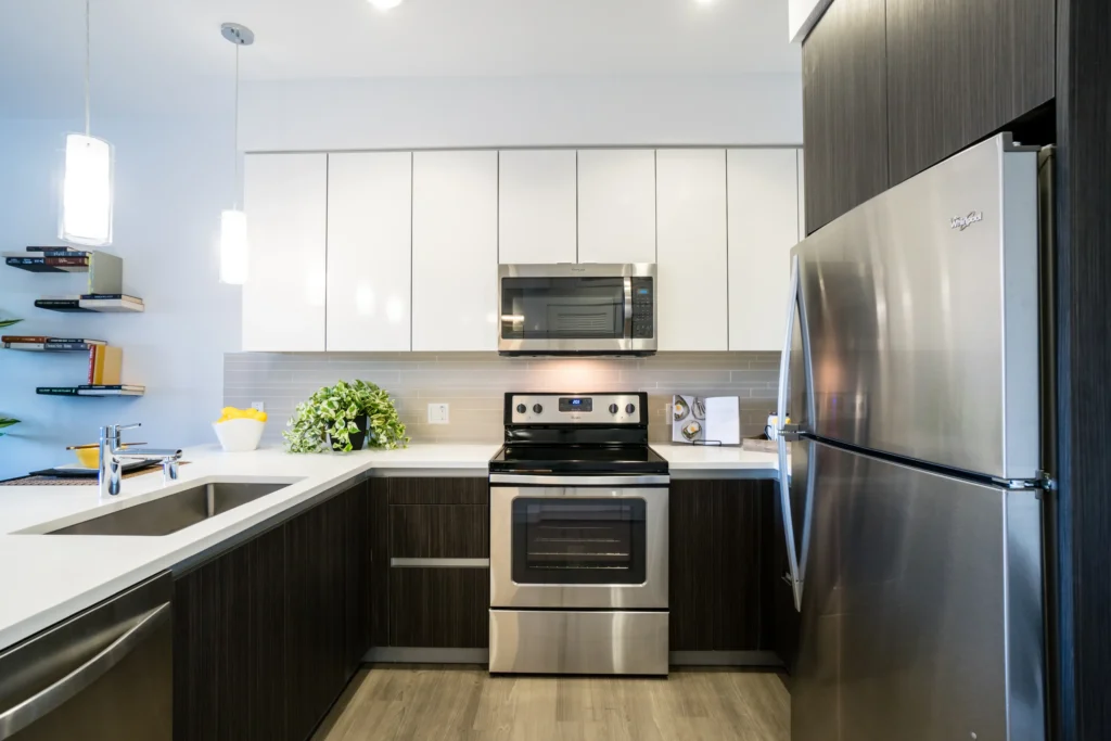 Kitchen with stainless appliances and tile backsplash