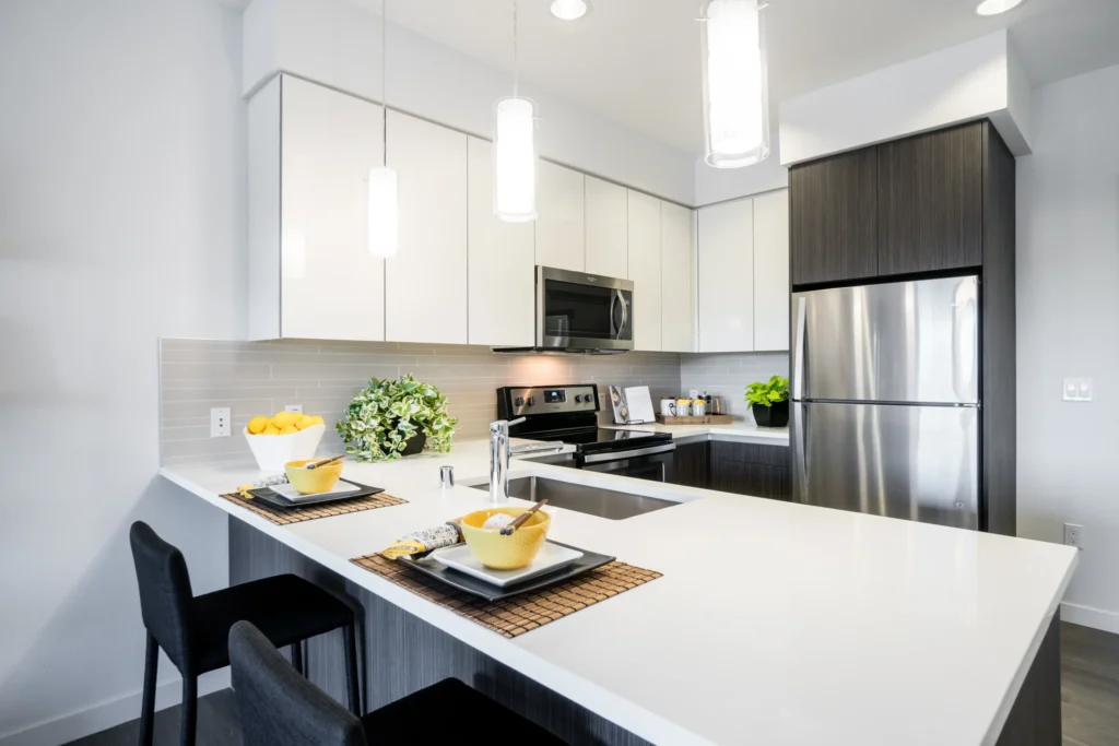 Kitchen with stainless appliances and tile backsplash