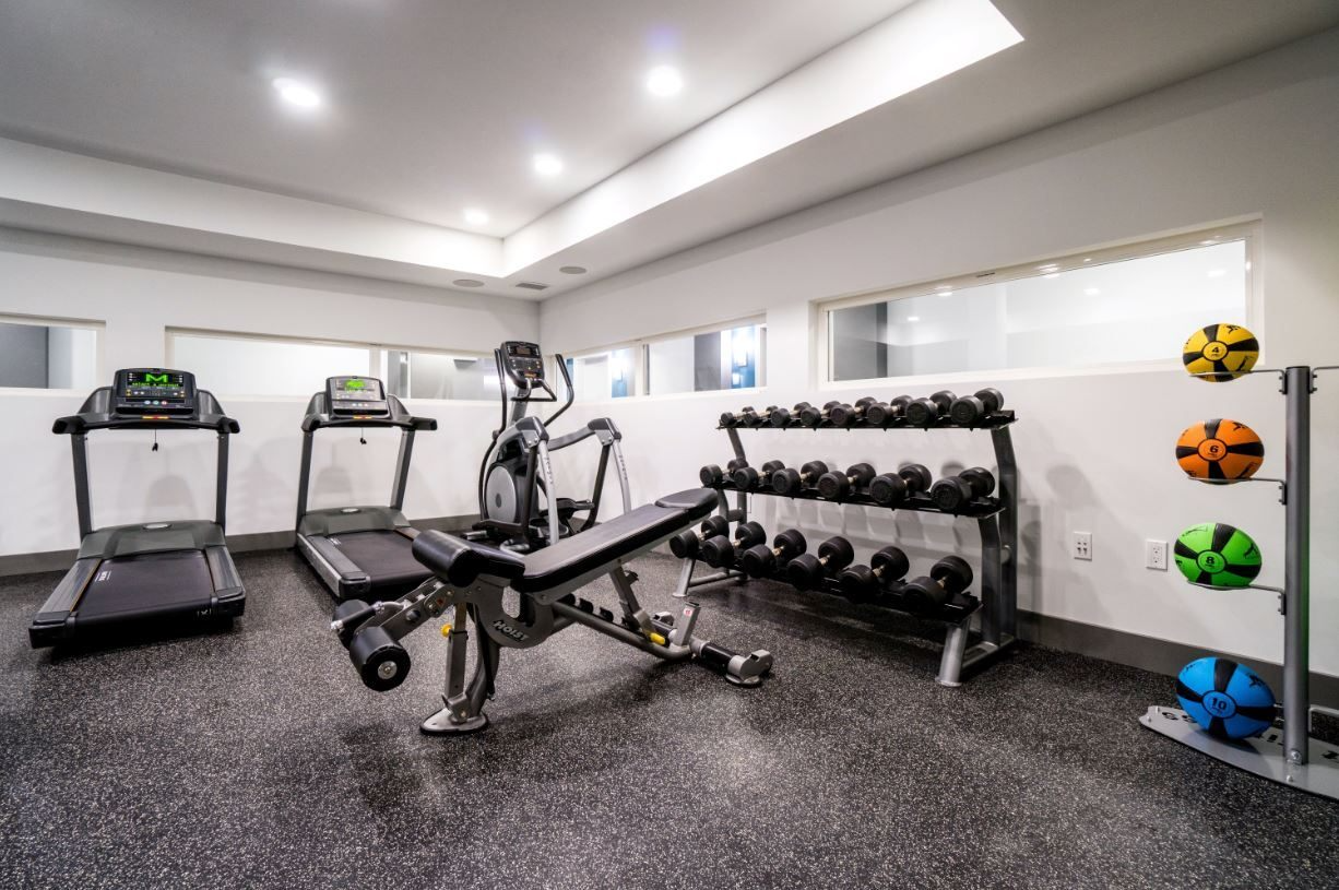 Fitness center with free weights and cardio machines